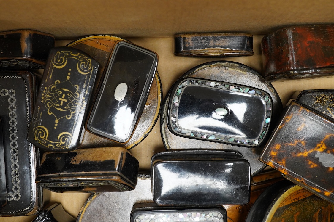 A collection of various snuff boxes to include papier mache examples, two with printed lids and some inlaid examples